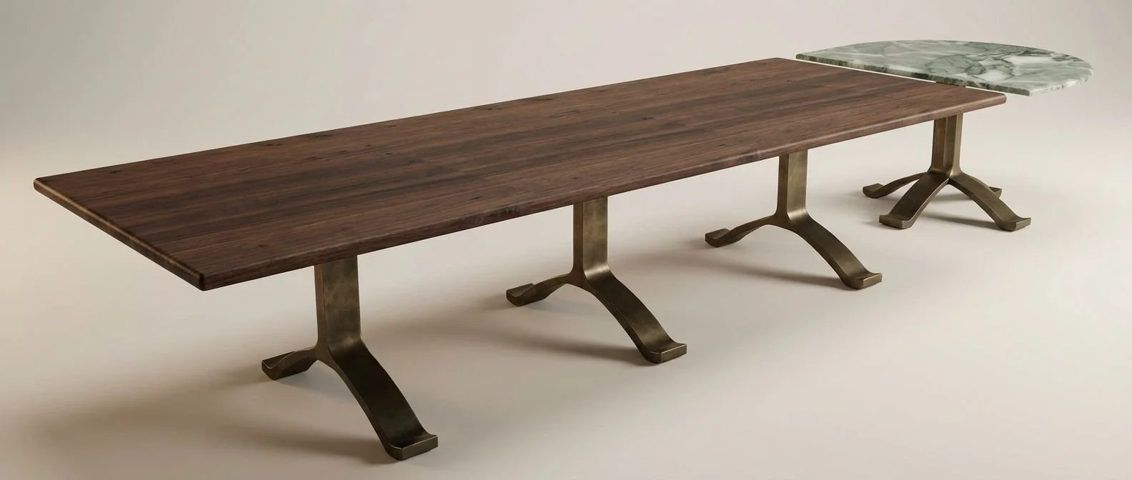 Long wooden table with three black metal pedestal bases, a section with a dark wood finish, and a small marble-topped extension on the right side.