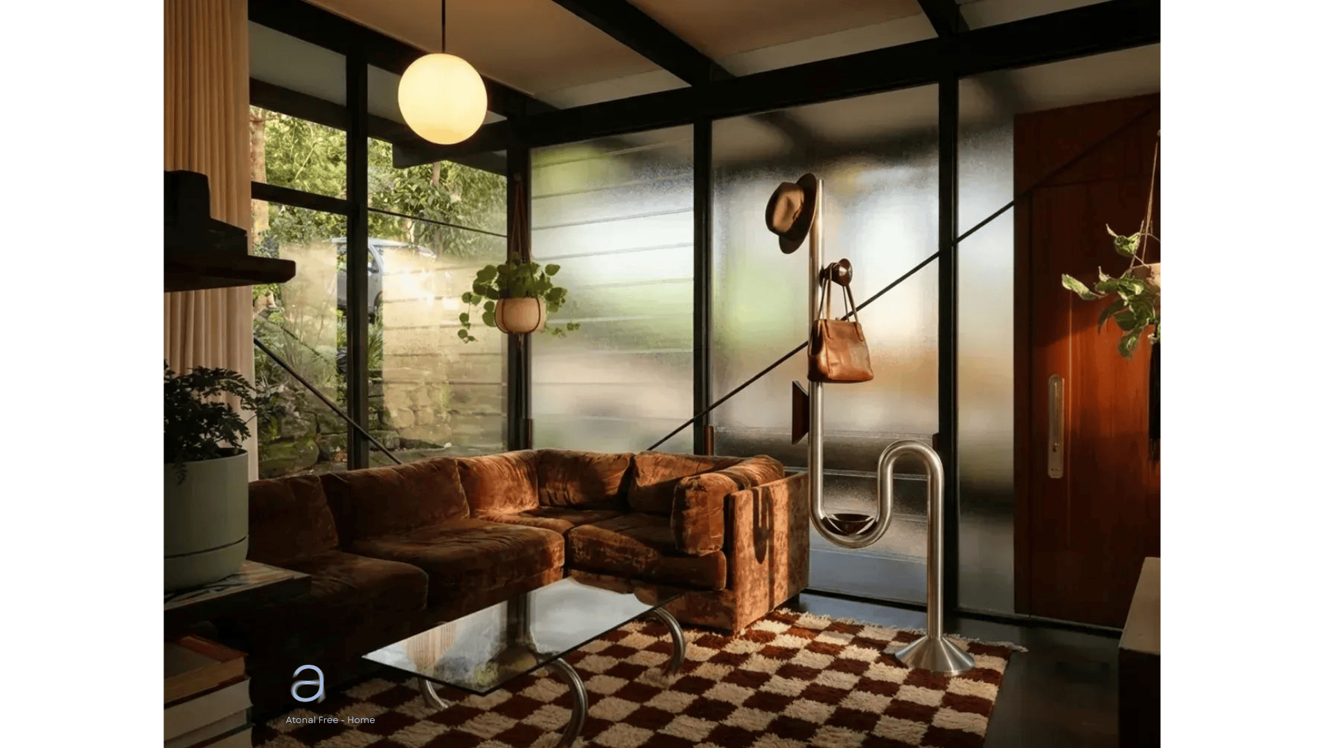 Modern living room with a large glass window, a vintage orange velvet sofa, a hanging potted plant, and a side table with a stack of books. A glass coffee table and unique coat rack with a hat and bag are also visible, with greenery outside the window.