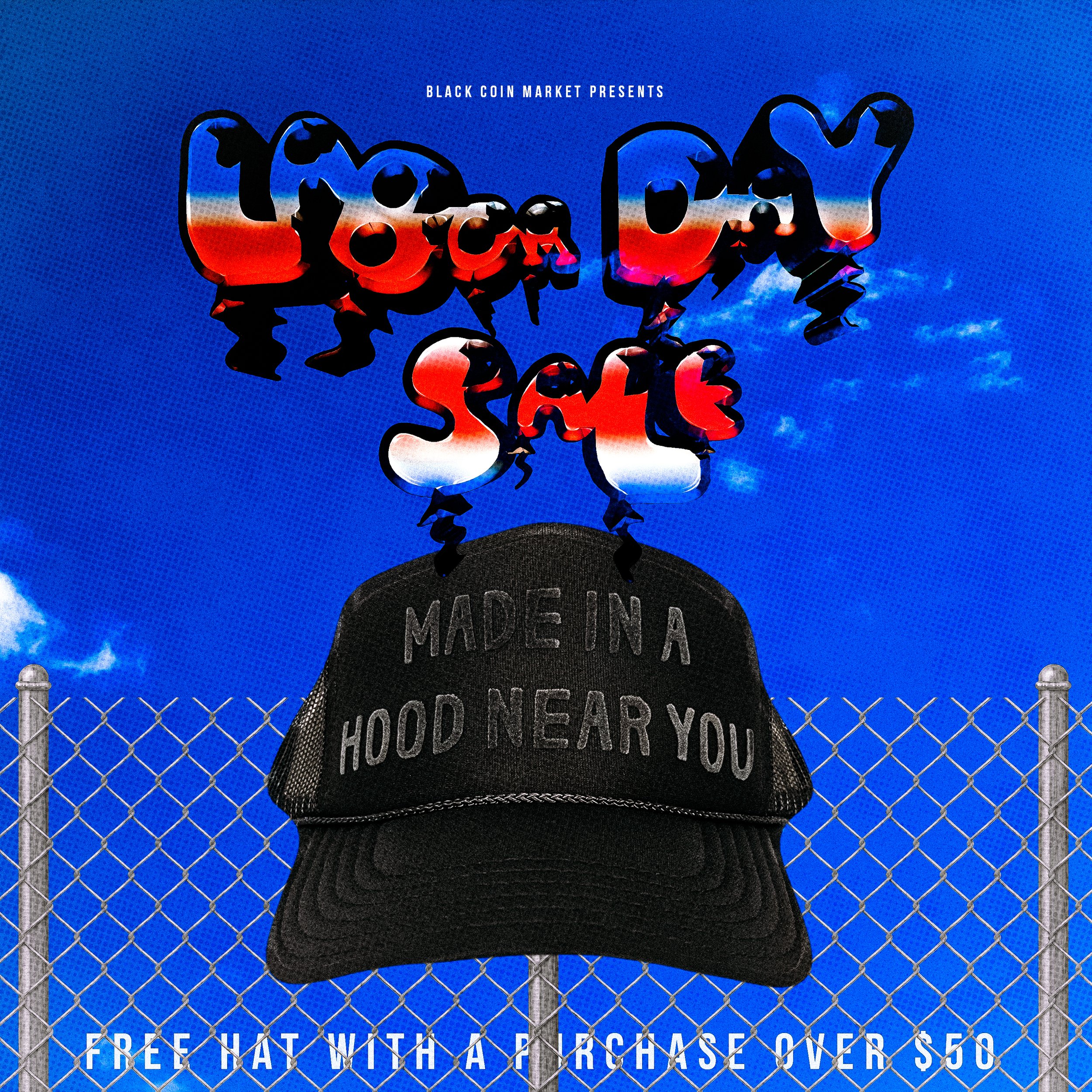 A promotional poster for a Black Coin Market event featuring a black cap with the text 'Made in a Hood Near You' hanging on a chain-link fence against a bright blue sky with white clouds. The poster advertises a free hat with a purchase over $50.
