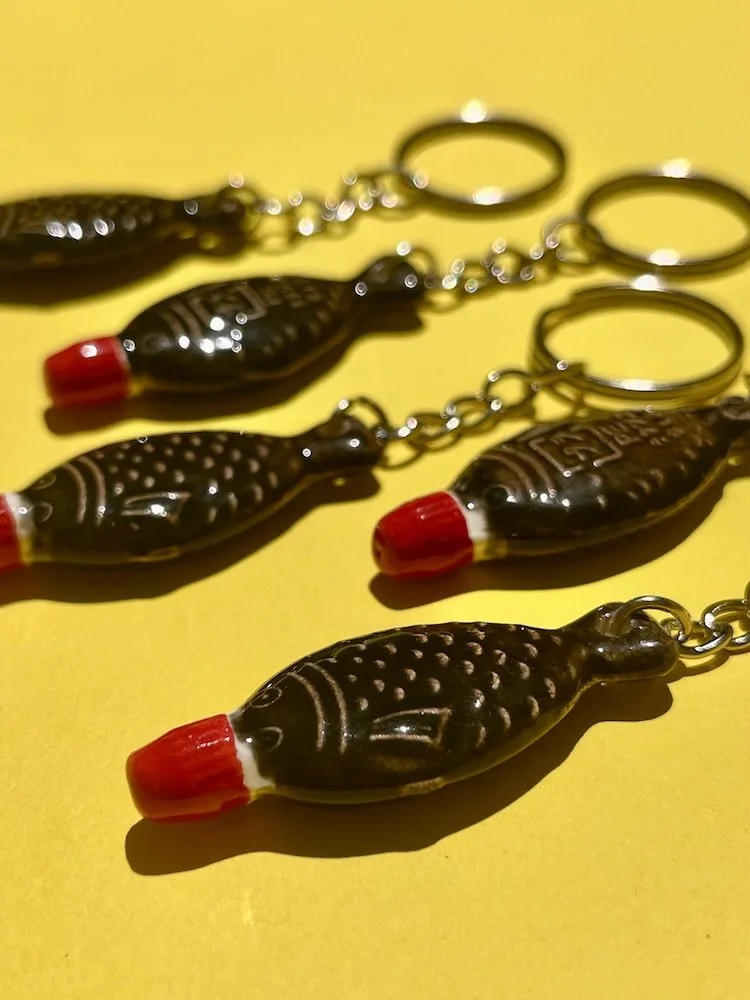 austin_flowers_ceramic_soy_sauce_fish_key_chain_quirky_black.jpeg