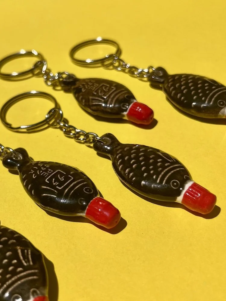 austin_flowers_ceramic_soy_sauce_fish_key_chain_quirky_black1.jpeg