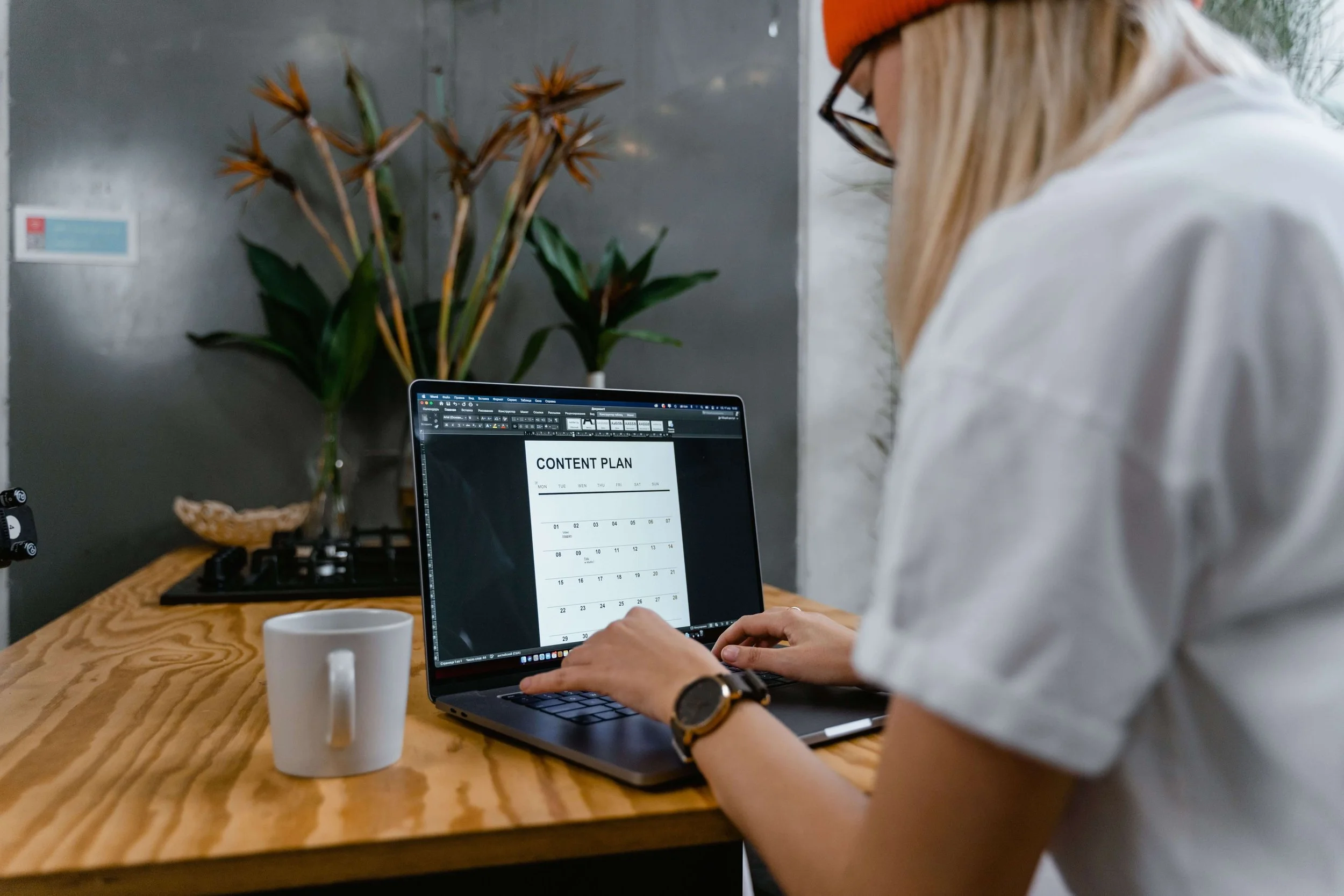 Person looking at content plan on laptop