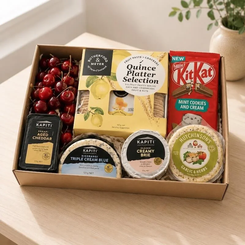Gift hamper with a selction of locally made cheeses, quince platter selection with crackers, chocolate and fruit. Delivery Levin.