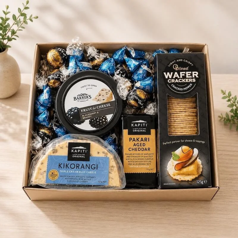 Cheese and chocolate hamper with cracker, cheeses fruit paste and assorted chocolatees.