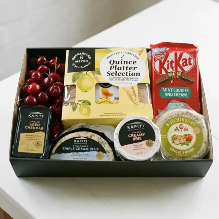 Gift hamper with a selction of locally made cheeses, quince platter selection with crackers, chocolate and fruit. Delivery Levin.