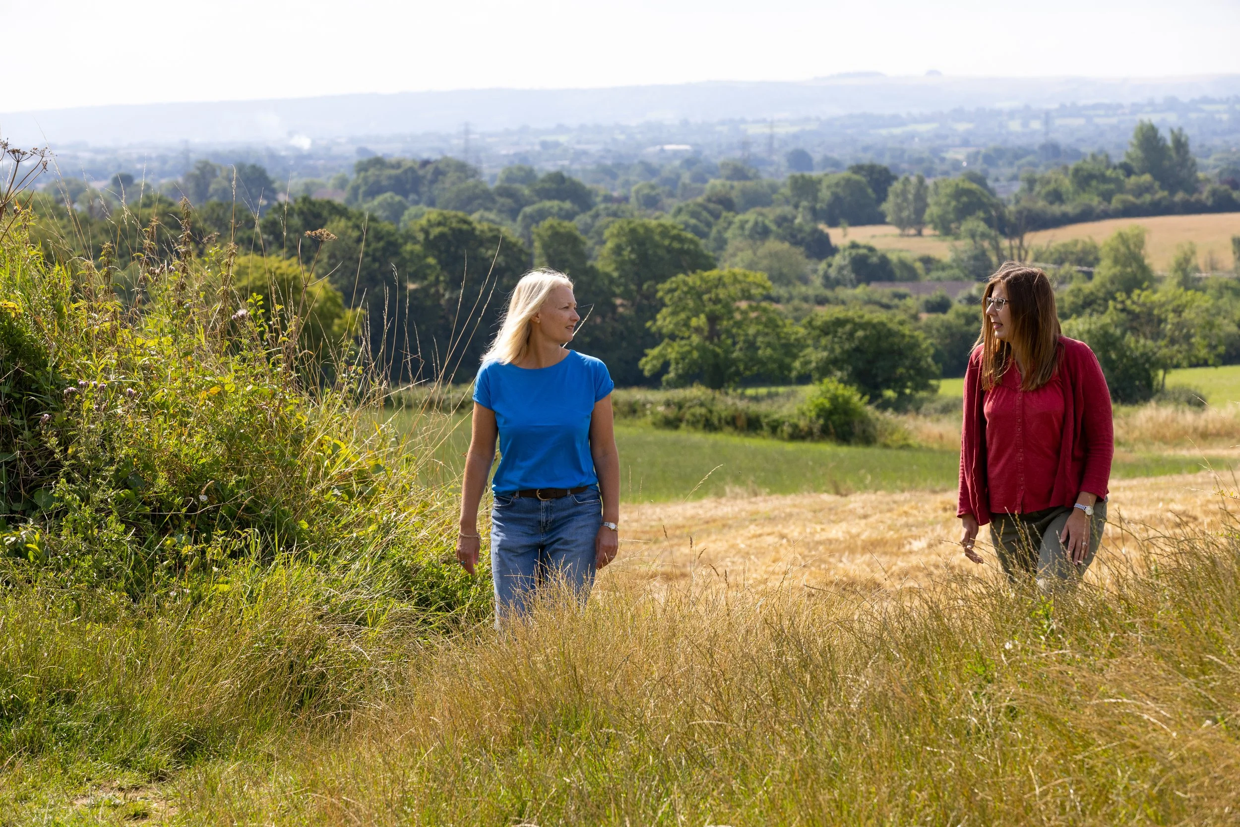 a walking coaching session with two women in the countryside
