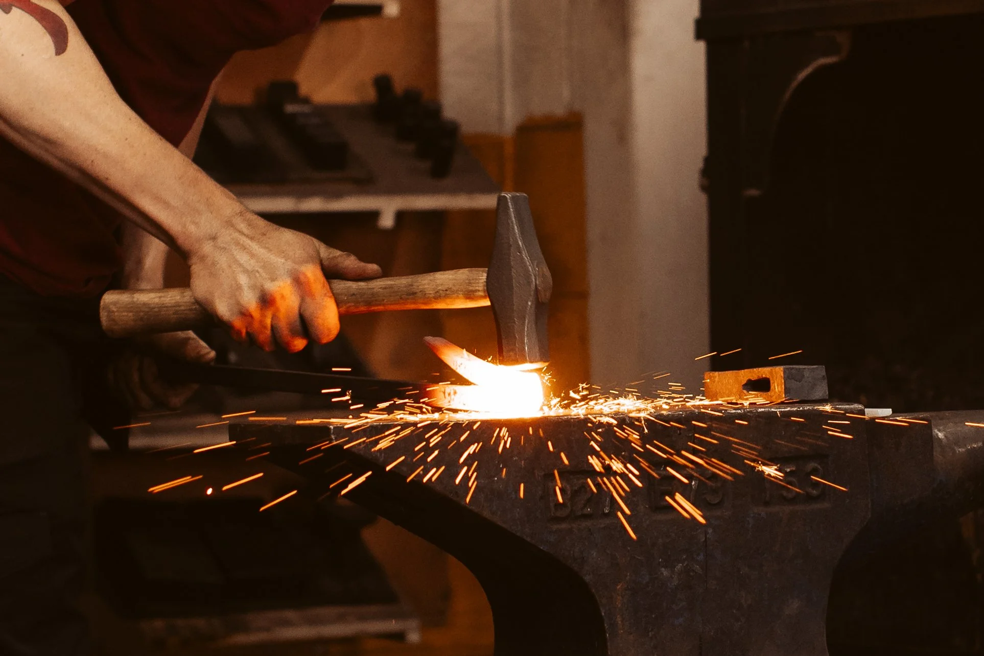 Forge welding hammer strike with sparks