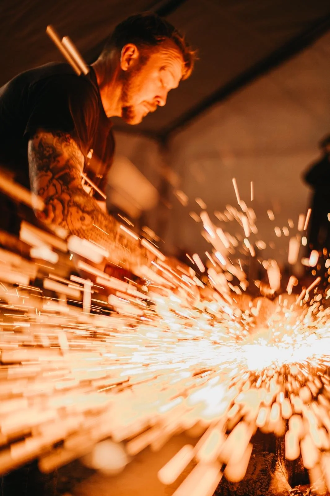 Blacksmith doing a hot forge weld.