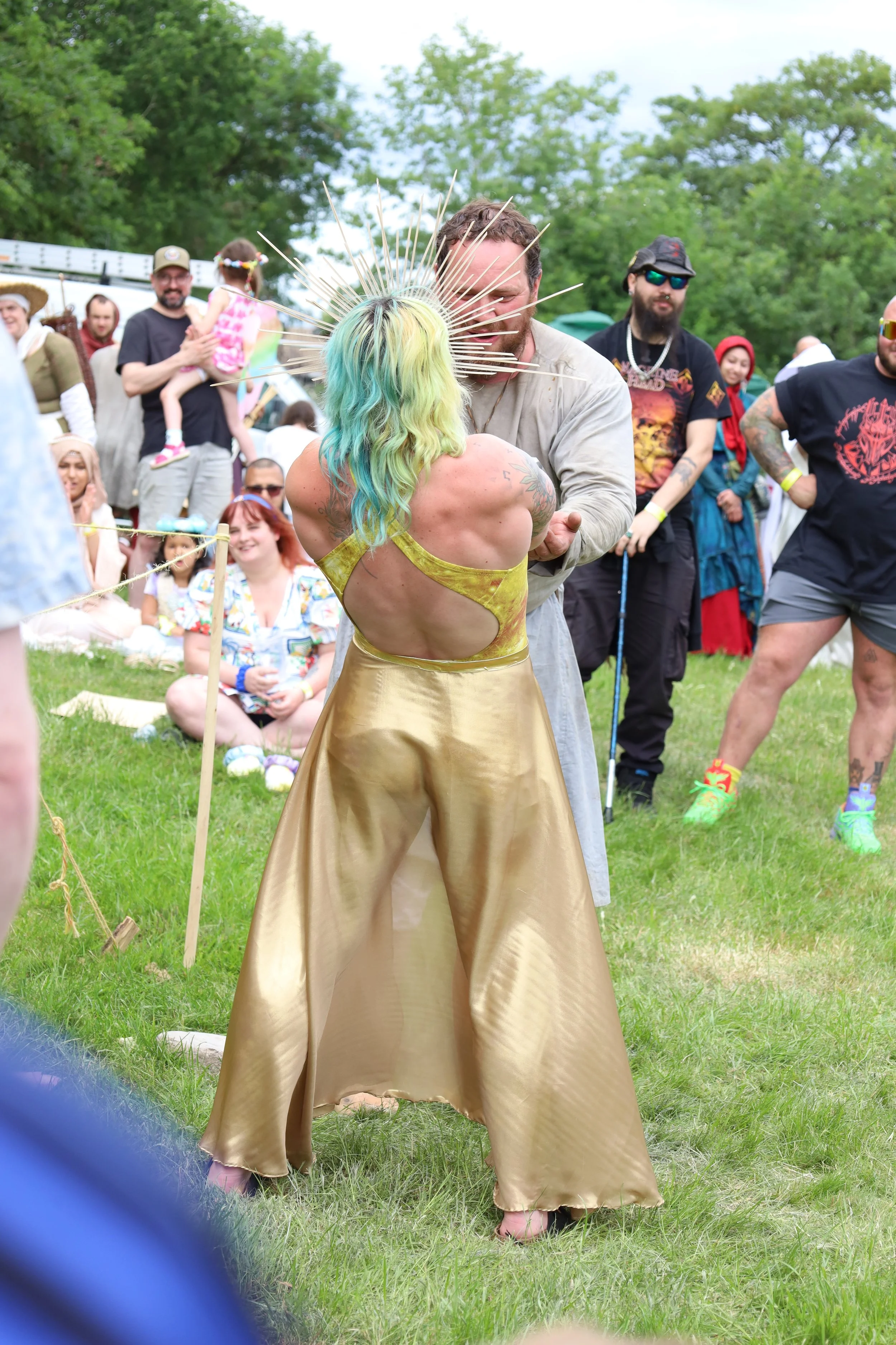 A woman competing in a hammer hold competition at the Tolkien festival blacksmithing stall