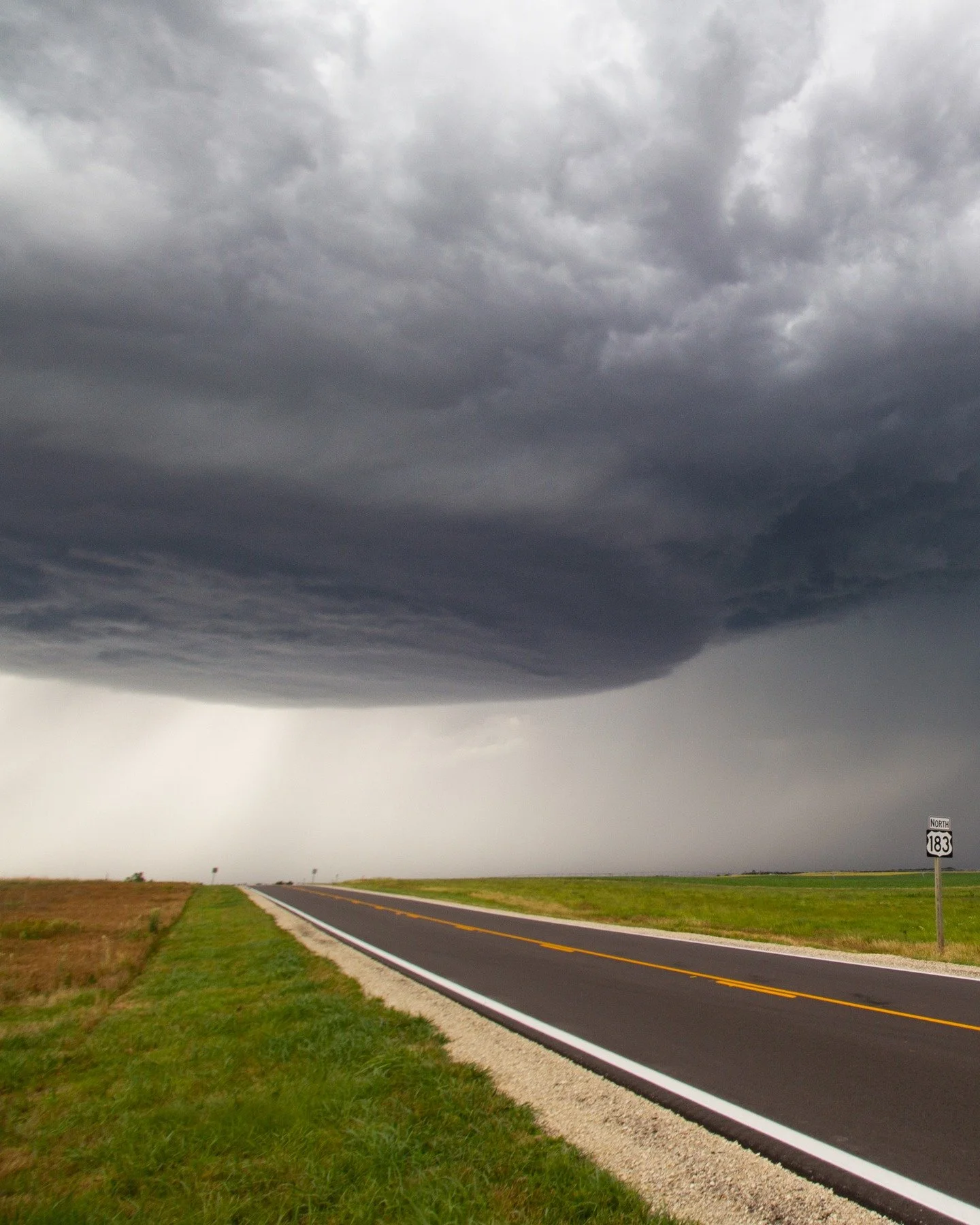 Incoming on Highway 183! Swipe for full image.
.
A supercell thunderstorm crosses the Oklahoma countryside.
.
.
.
#thunderstorm #stormchasing #lightning #weather #ig_stormclouds #nature