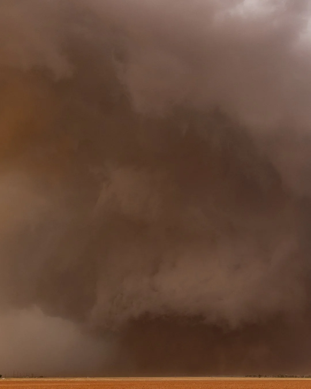 A ragged beast of a tornado churns up the ground near Morton, Texas, June 5th 2025.
.
This storm was pulling in huge amounts of dust, giving the sky a red tinge. It produced several tornadoes including this wedge, which at one point, was a mile wide.
