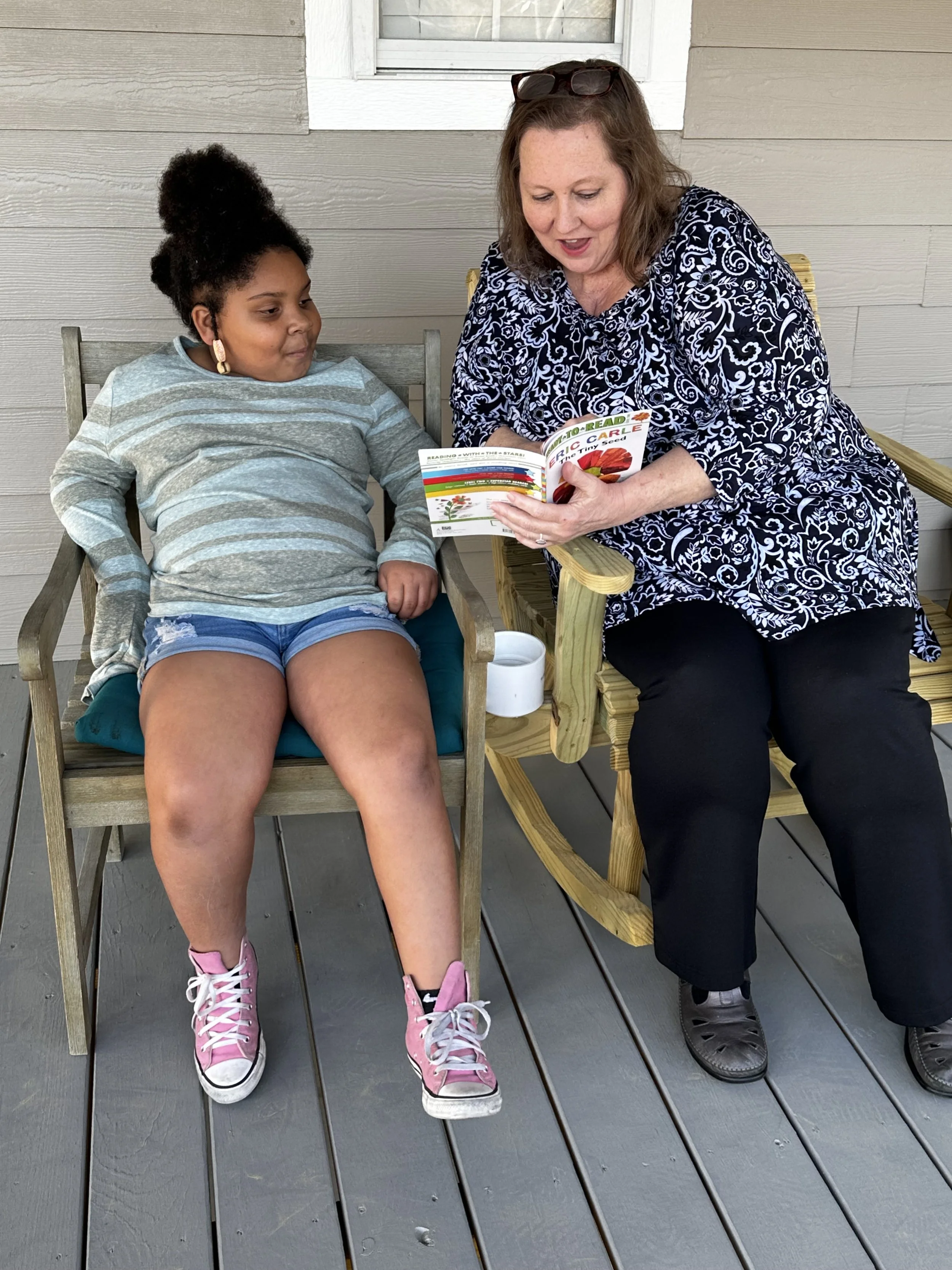 Rocking and reading with Jovi and Ms. Melissa!