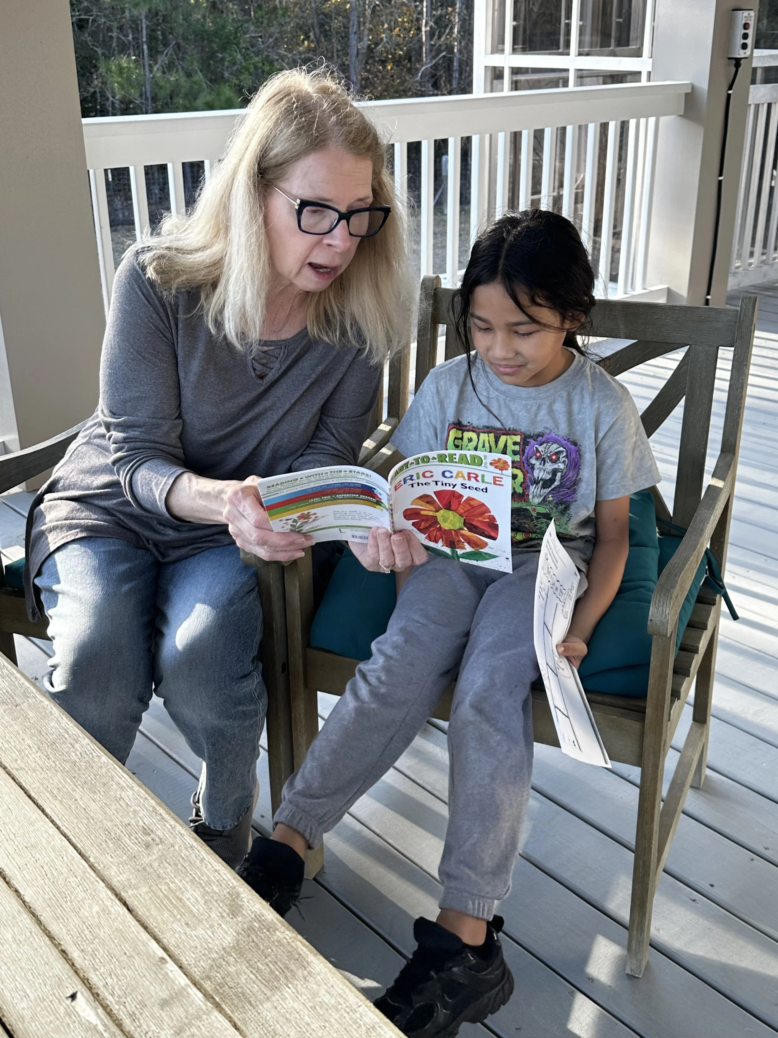 Fun reading in the sun with Ms. Wendy and Aramis.