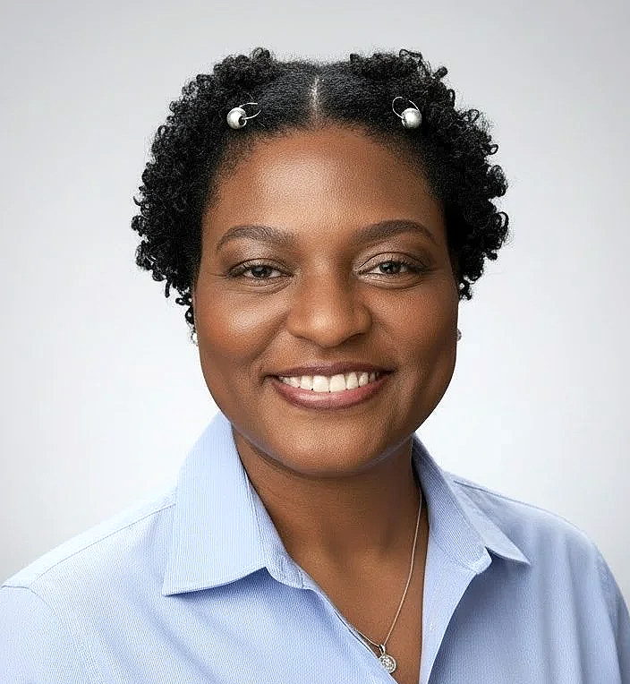 A woman against a gray background.