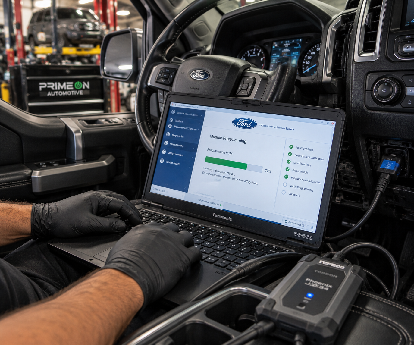 Technician programming a vehicle PCM and electronic control module at PrimeOn Automotive in Fort Worth, TX.