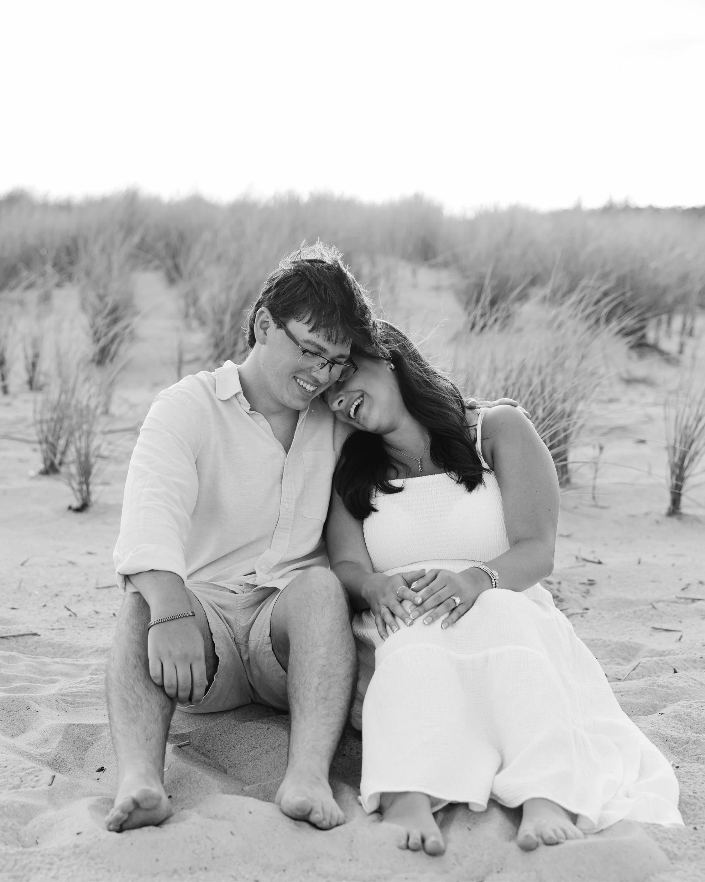 Alex proposed to Rhi on a quiet afternoon in Dewey Beach, Delaware. While driving down to the beach it was so gloomy and no joke, as soon as he opened the ring box, the sun popped out. It ended up being a beautiful evening! There&rsquo;s nothing bett