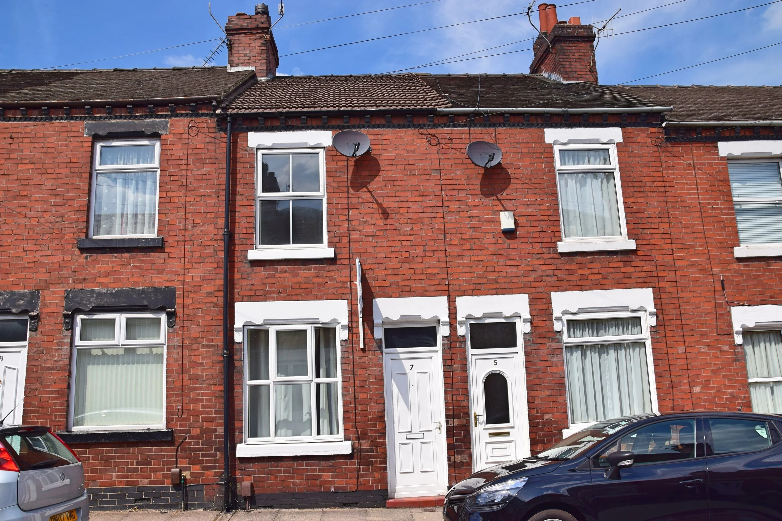 Front exterior of a red brick two bedroom terrace house on Smithchild Street, Tunstall, Stoke-on-Trent, ST6 5HB, available to rent for £700 pcm.