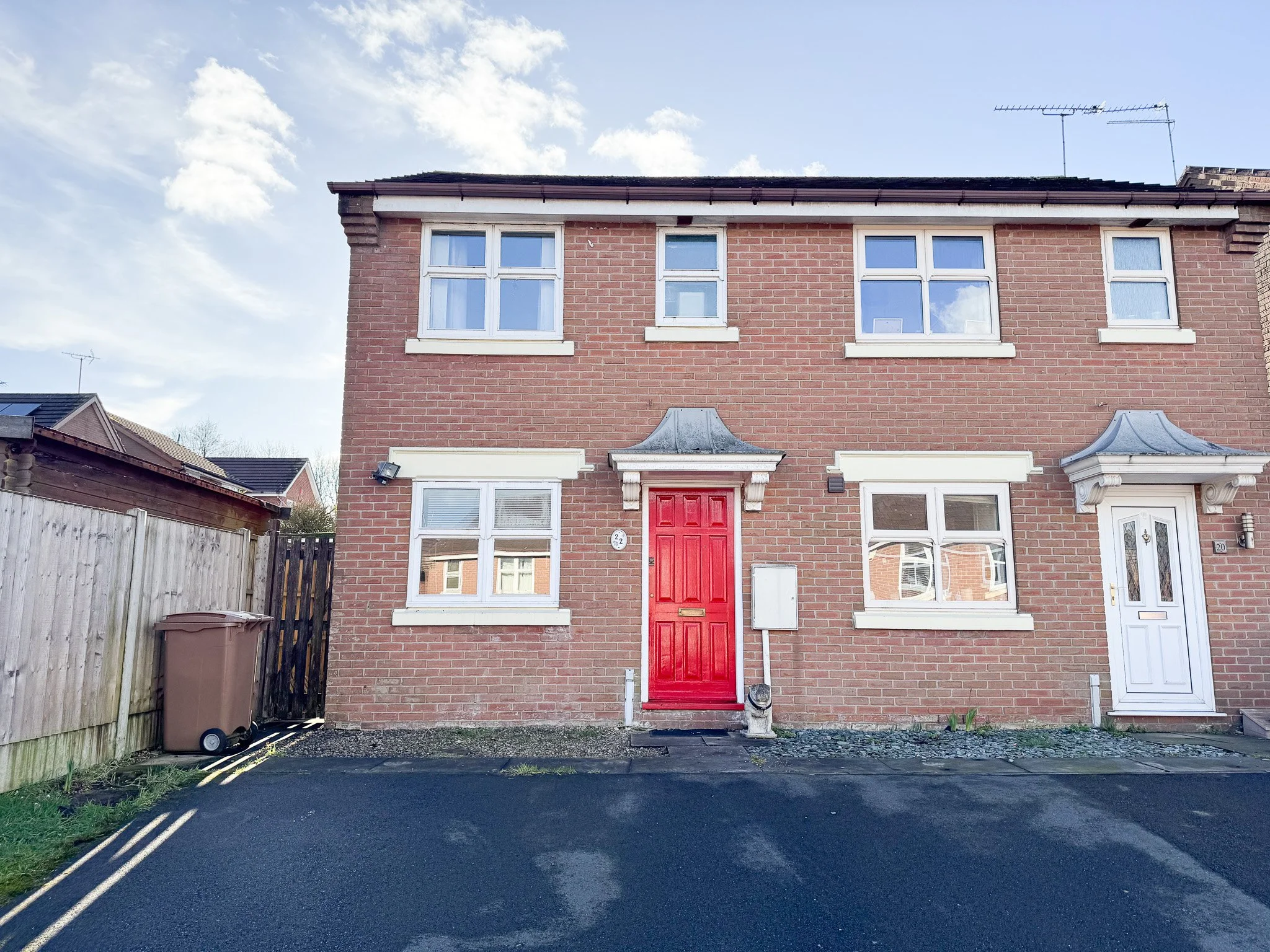 Two bedroom semi-detached house to rent on Caraway Place in Meir Park, Stoke-on-Trent with brick exterior, red front door and off-road parking.