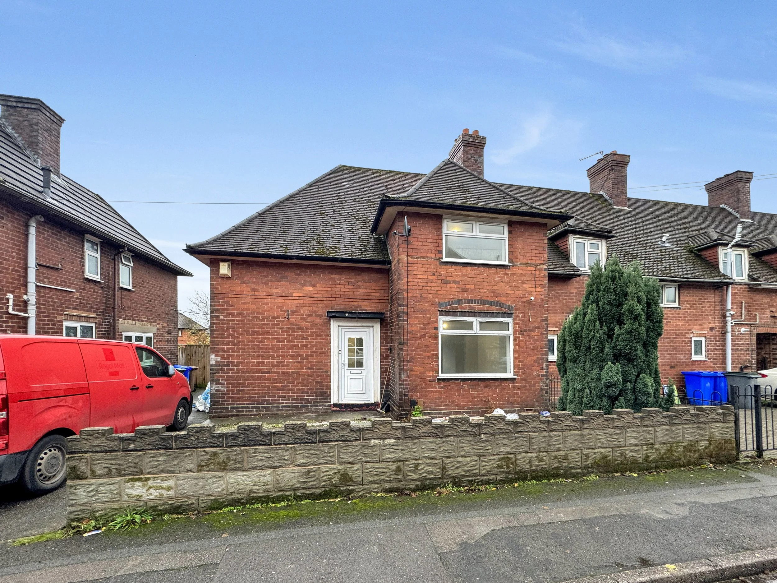 Front view of the three bedroom home on Sproston Road, Tunstall with driveway and blue sky