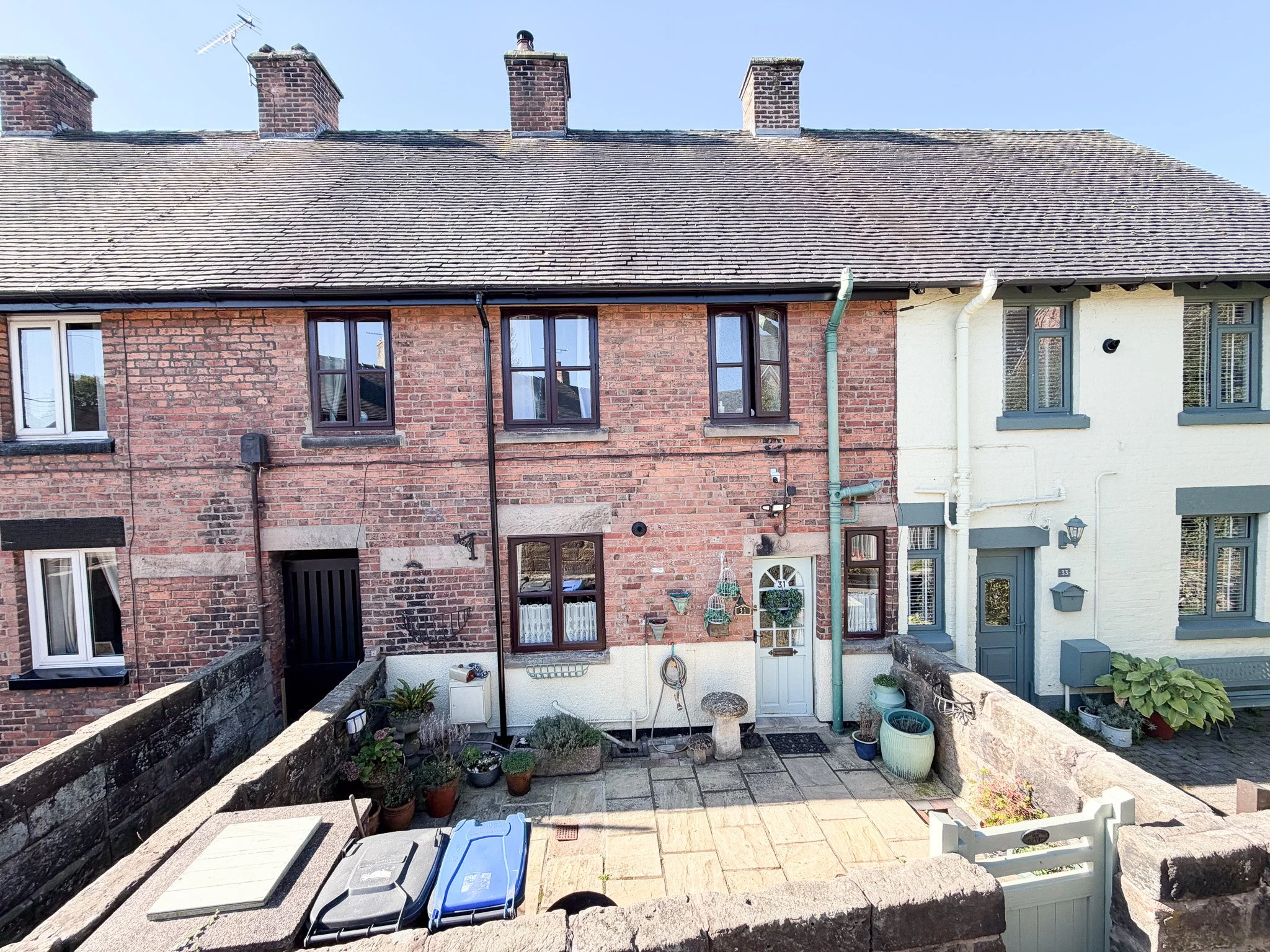 Front exterior of three bedroom 19th century cottage in Adams Valley, Tean, with traditional brickwork, period character and enclosed paved frontage.