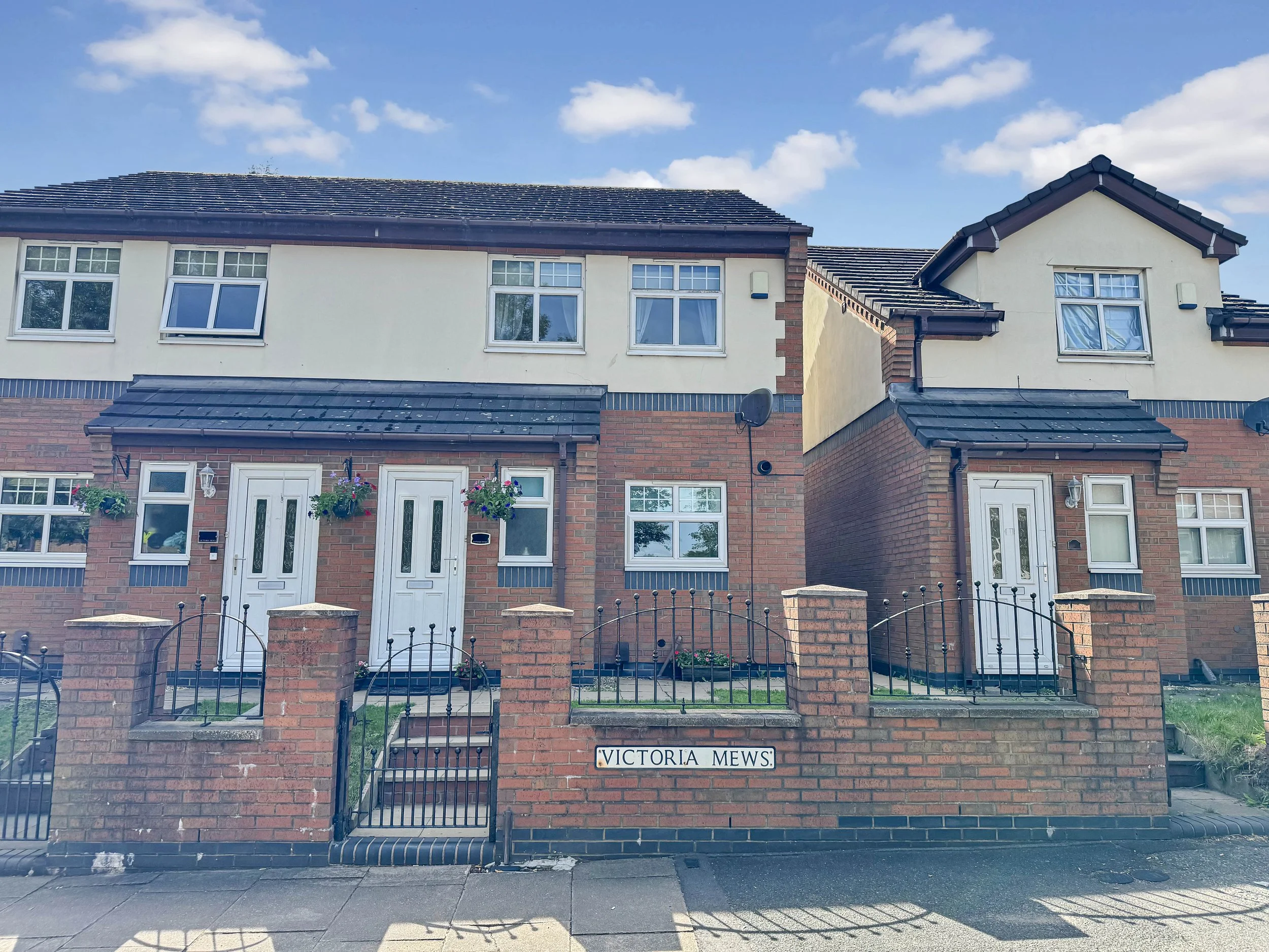 Modern townhouse at Victoria Mews, Victoria Street, Basford, Stoke-on-Trent ST4, featuring contemporary brick construction and attractive front gardens.