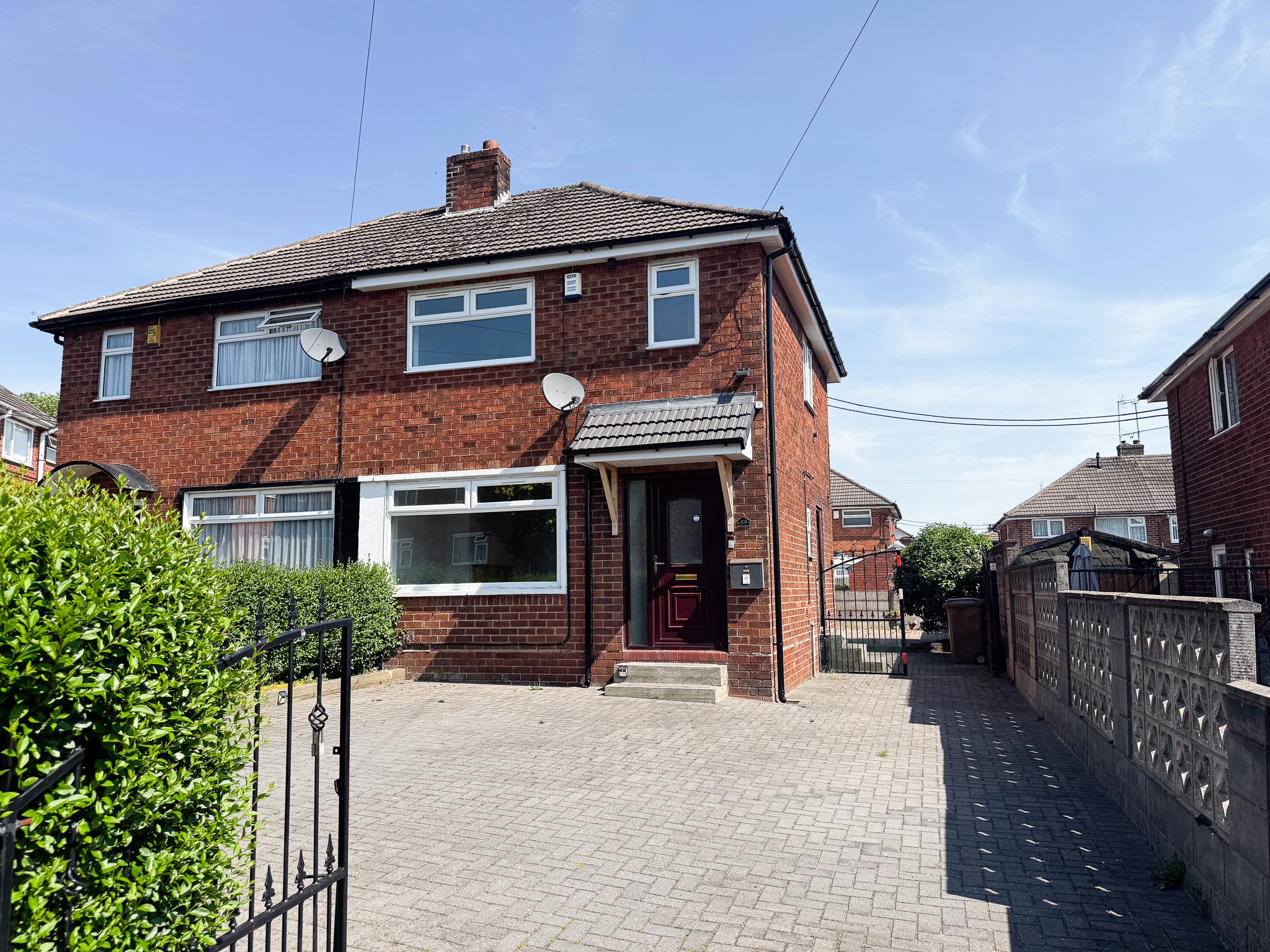 Front elevation of Lansbury Grove, Meir, Stoke-on-Trent, showing the two bedroom semi detached house with block paved driveway and attractive brick frontage.