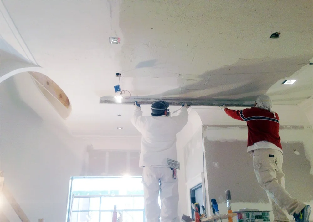 Artisan flanking a ceiling