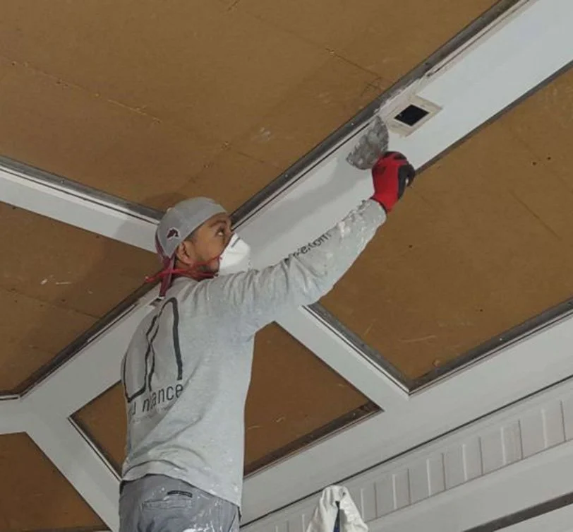 Metal light frames are bonded to wood ceiling framework