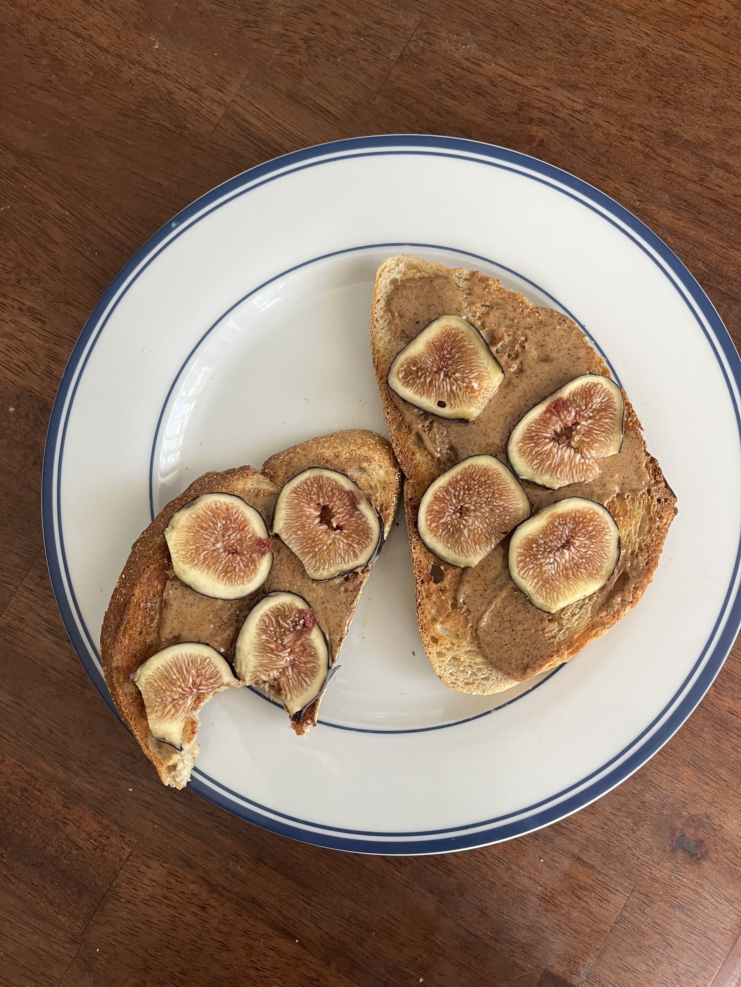 homemade sourdough bread slathered with almond butter and topped sliced figs