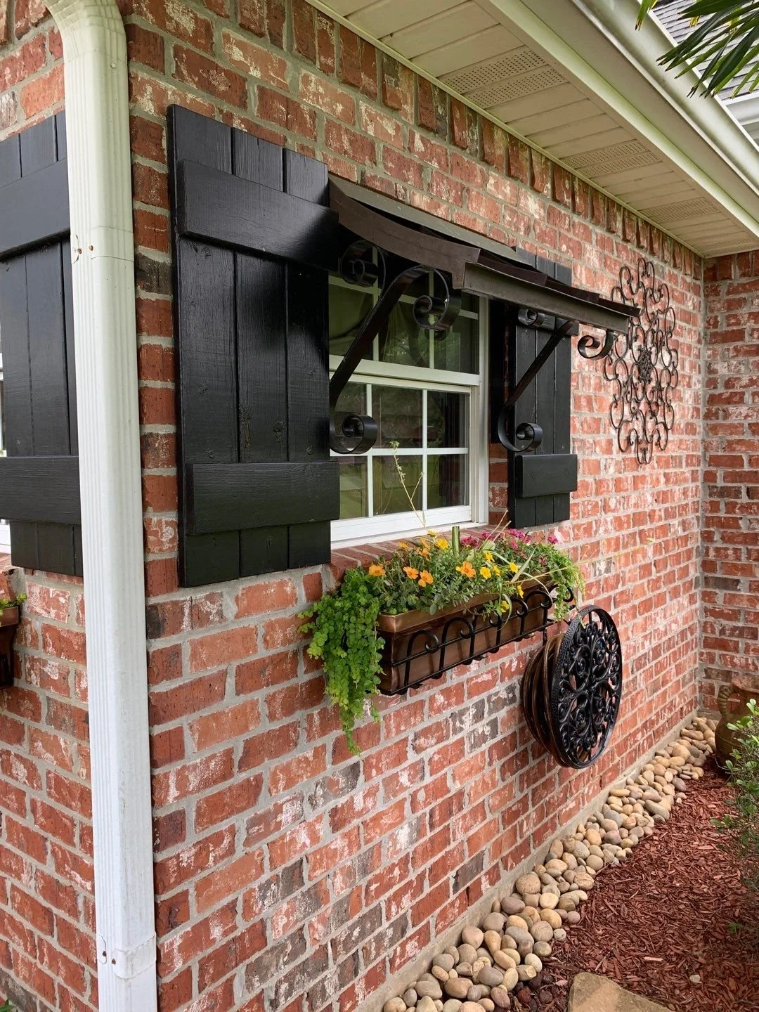 metal awning and wood shutters.jpeg