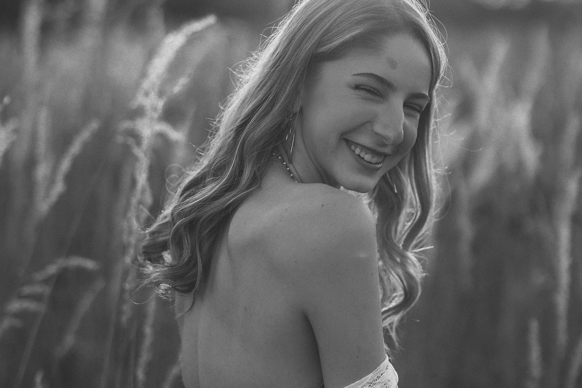 a black and white senior portrait of a teen girl in loveland ohio. Senior portraits by emily ann russell photography.