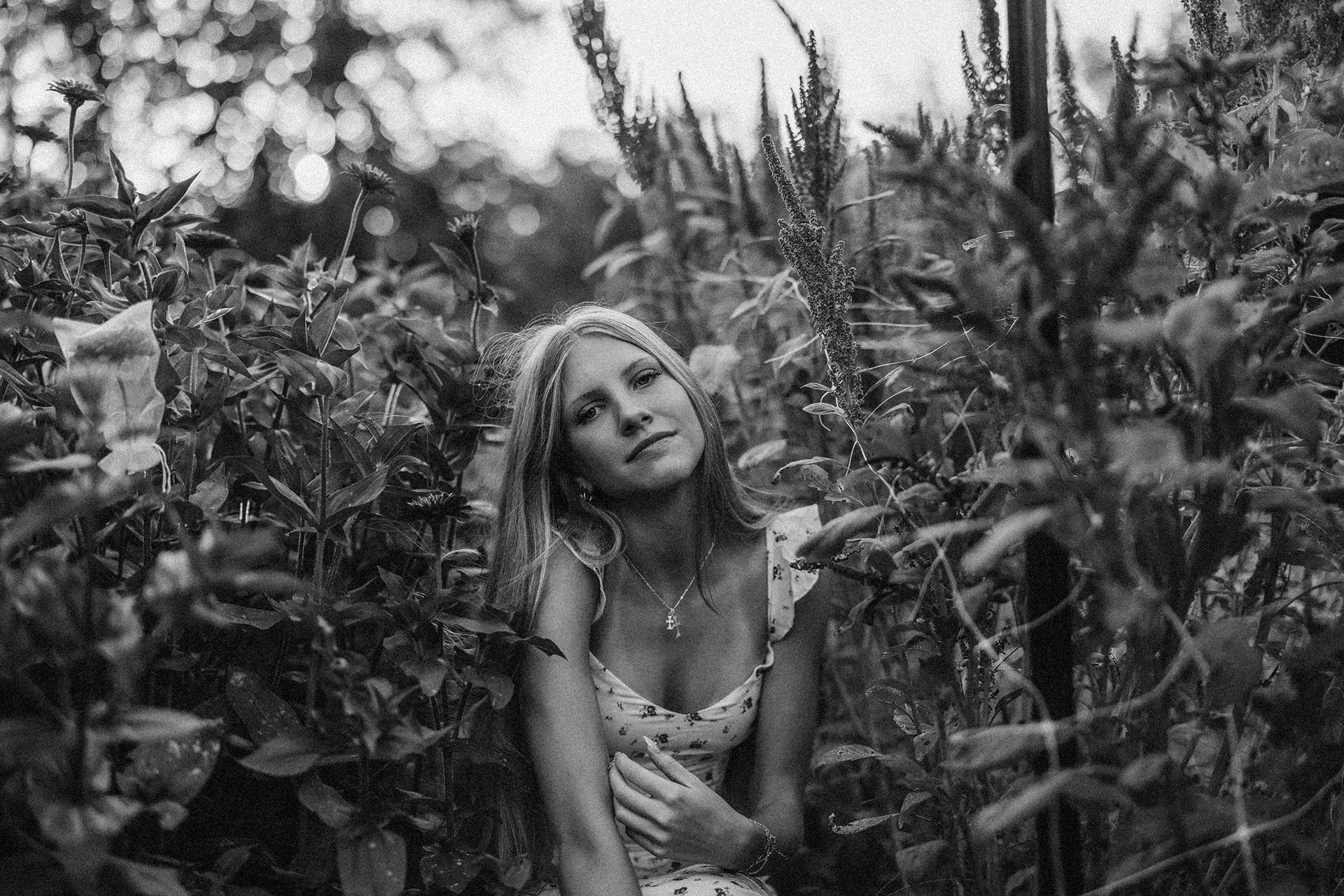 A Loveland Ohio senior girl smiles in the wildflowers.