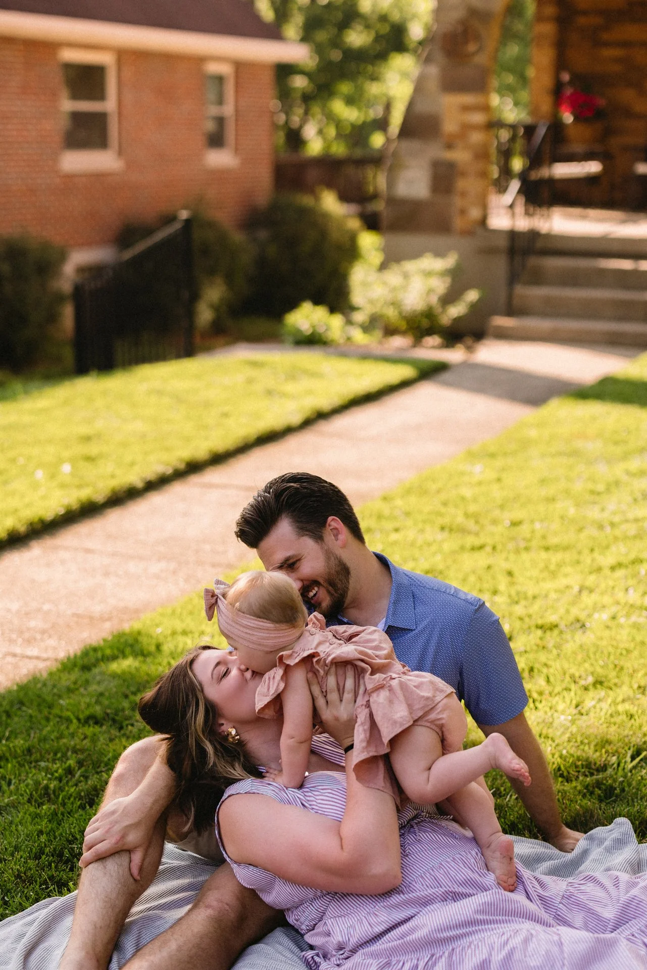Candid family photos in Loveland ohio outside of their summer home.