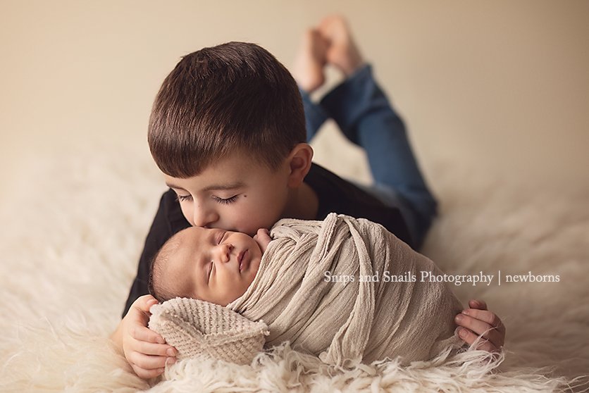 Mom says, &quot;He doesn't have much interest in the baby...&quot;
Really? :)