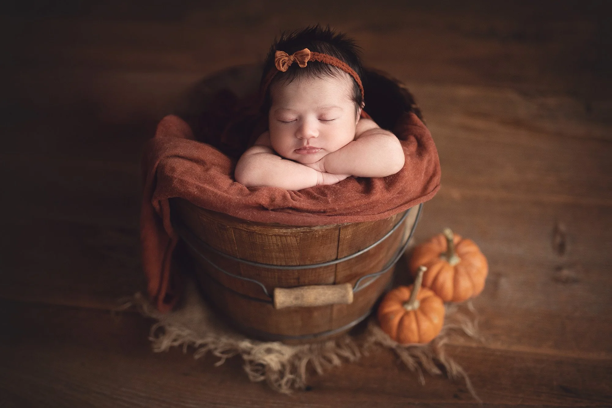 newborn in a bucket.jpg