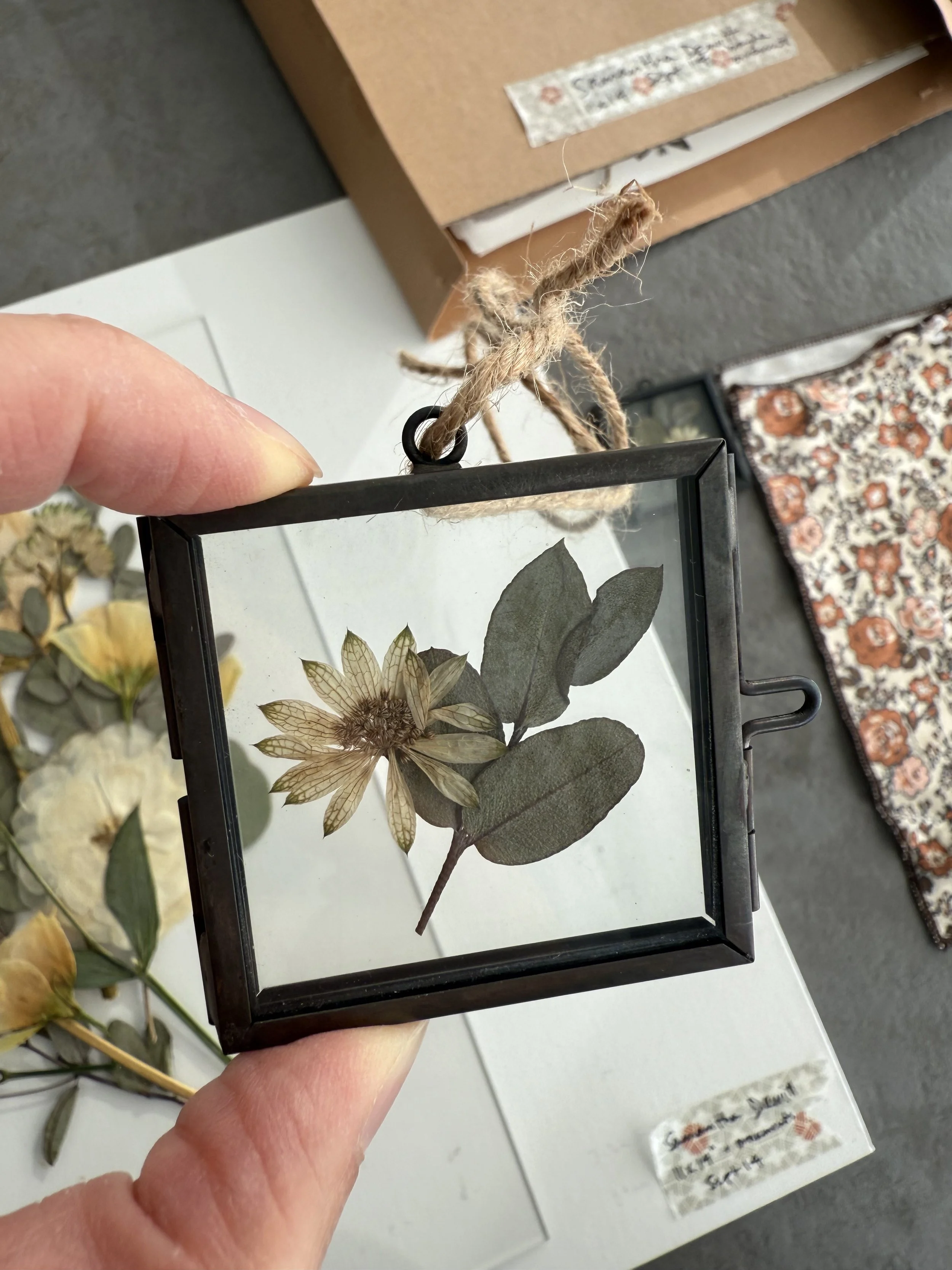 Pressed wedding bouquet preserved in glass ornaments