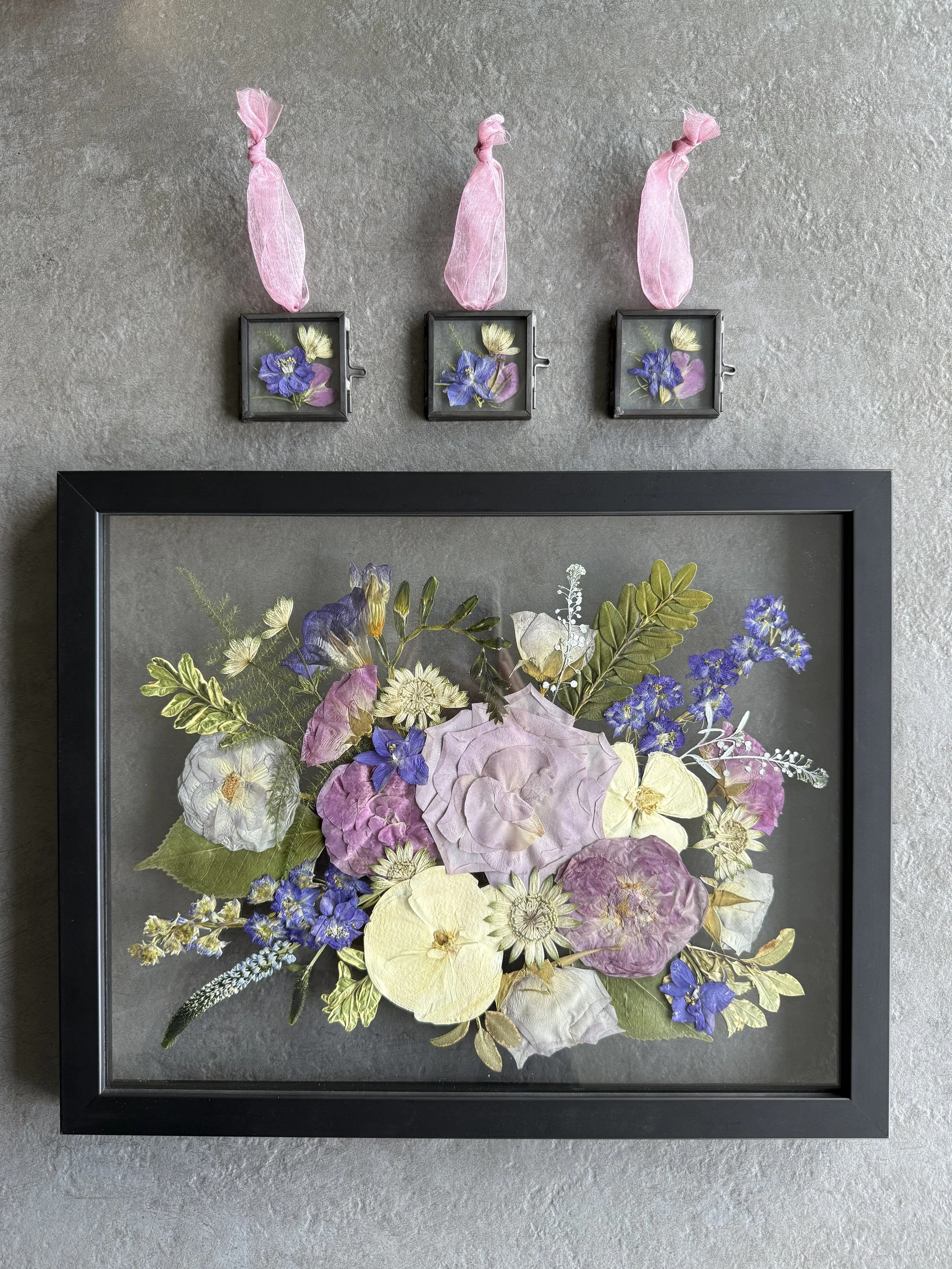 Pressed wedding bouquet preserved in glass ornaments