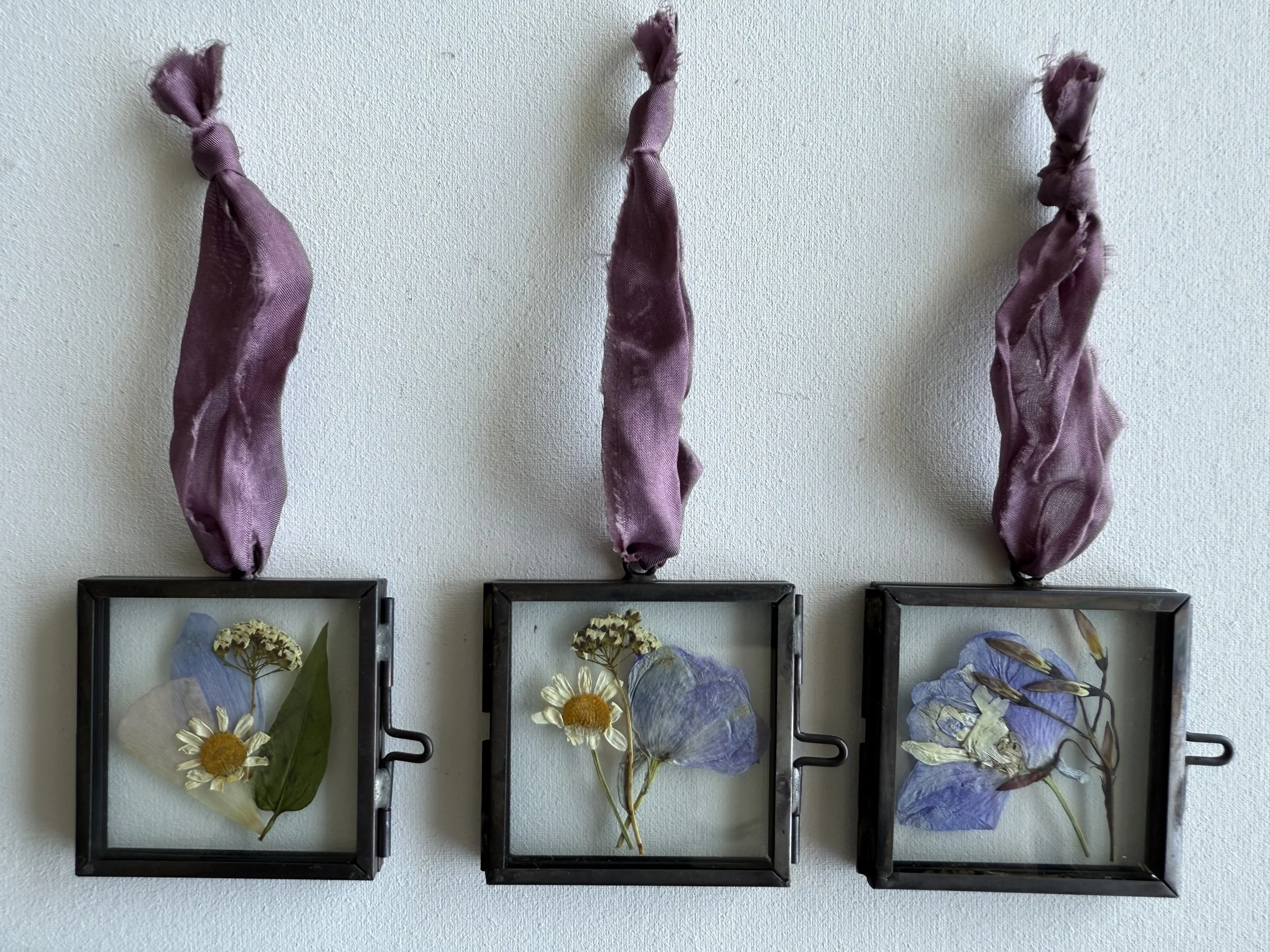 Pressed wedding bouquet preserved in glass ornaments