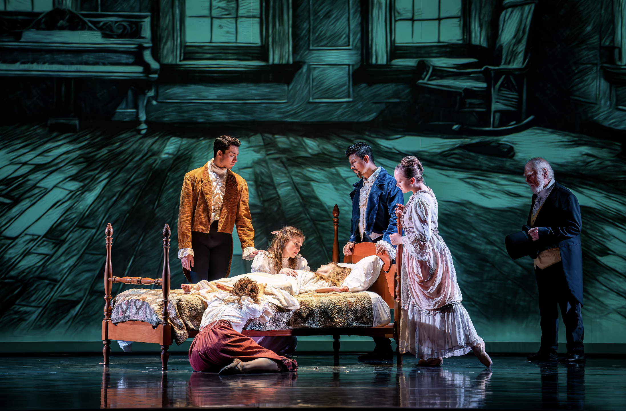 Stage scene with actors performing a play, featuring a bed with a woman lying on it, surrounded by characters in period costumes, backdrop of a painted room.