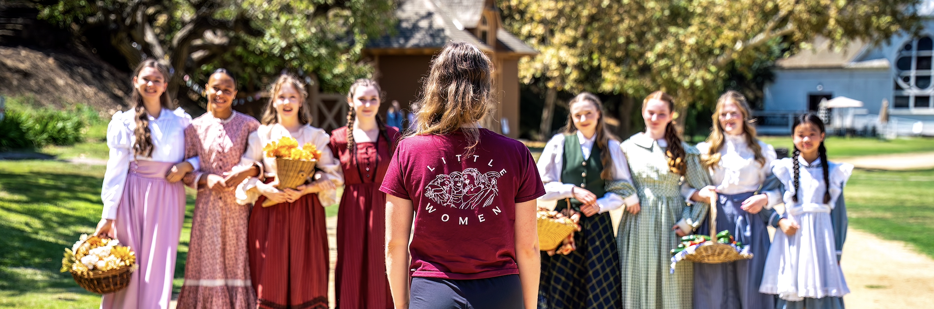 Little Women Ballet dancers in period costume outdoors at Heritage Square Museum.