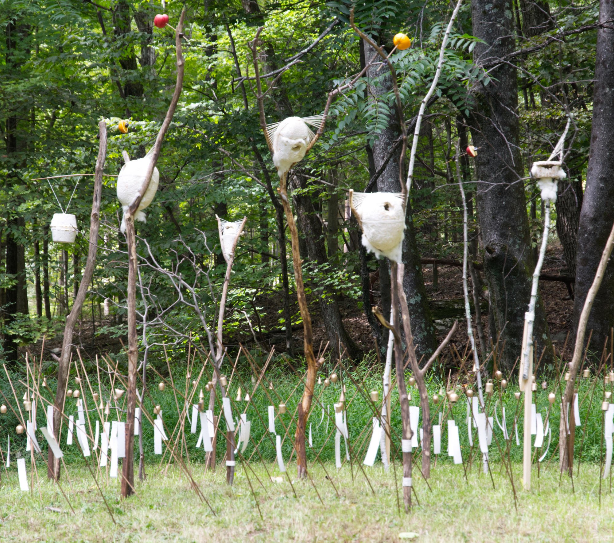  Kelly M O'Brien,  Grounded and Winged . Cast mycelium, cotton cord, wool, foraged wood, fruit, recycled tin, monofilament, paper. 140 h x 220 w x 168 inches ©2023 