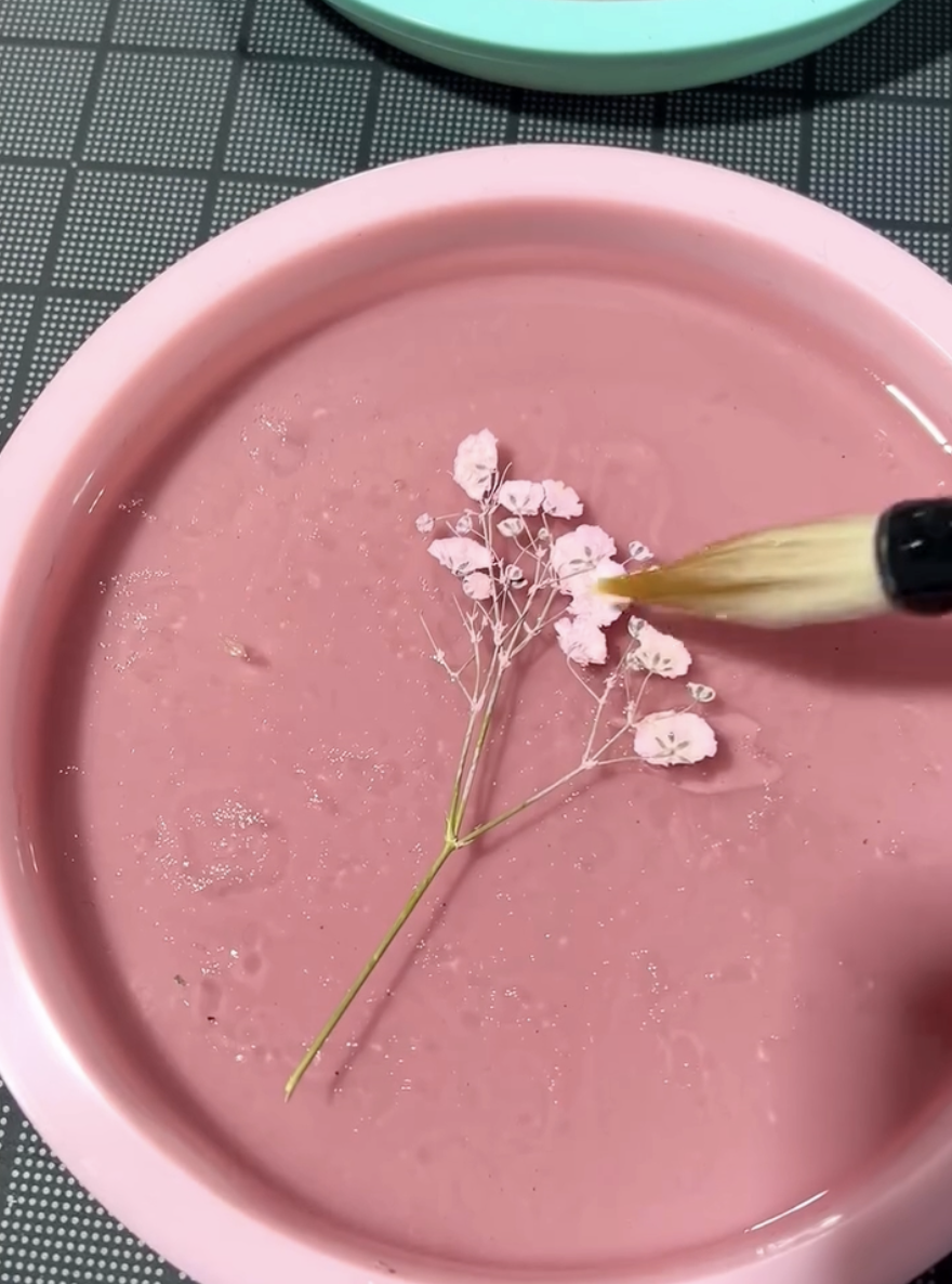  Each cast requires multiple layers. Botanical inclusions are included in the final layers and thoroughly sealed with the same formula. 