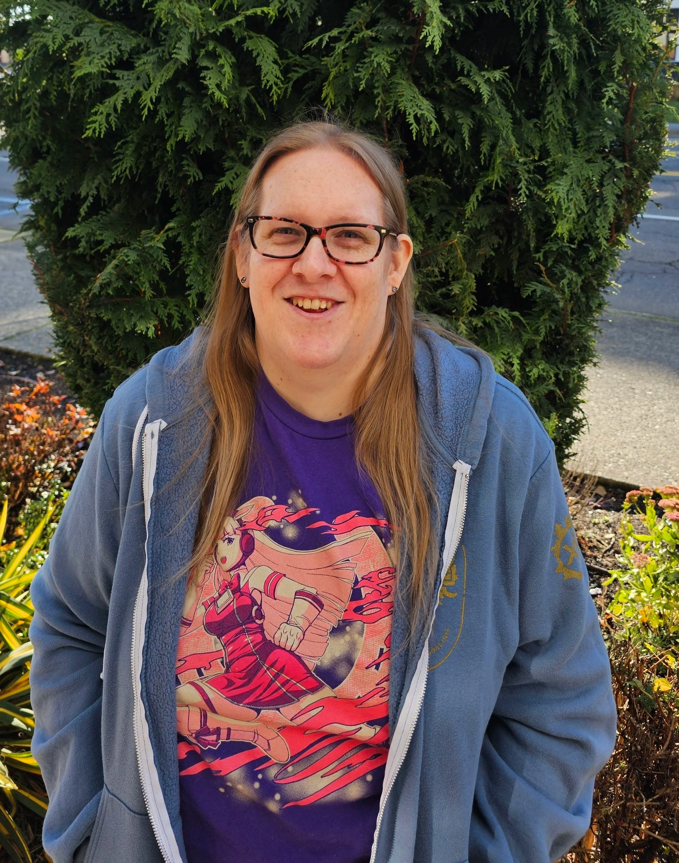 A photo of Emily, looking at the camera and smiling.