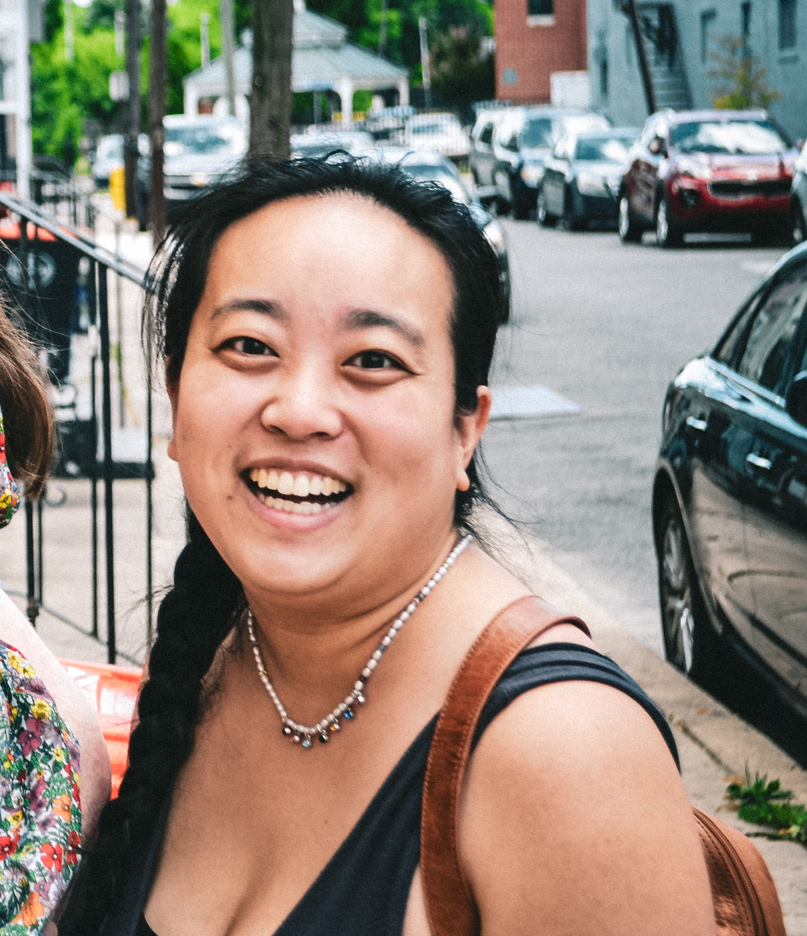 A photo of sung looking at the camera and smiling.