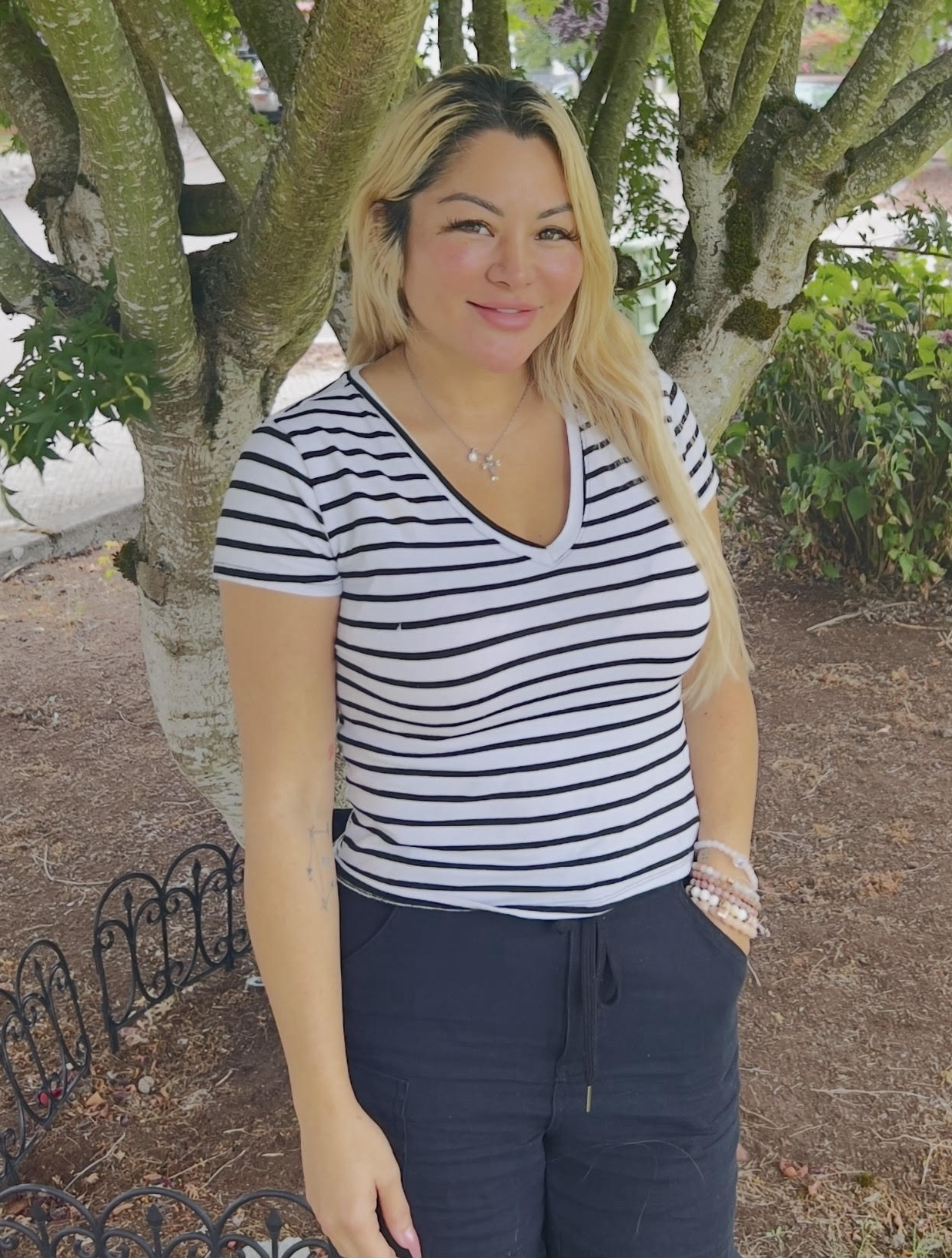 A photo of Jennifer smiling at the camera.