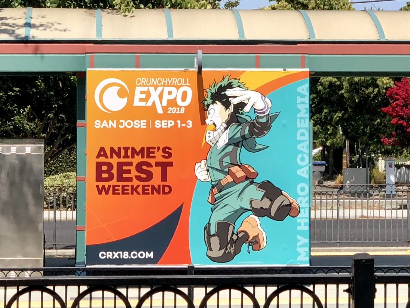Colorful banner promoting Crunchyroll Expo 2018 in San Jose, September 1-3, featuring an anime character with green spiky hair, wearing a green outfit, mid-air pose.