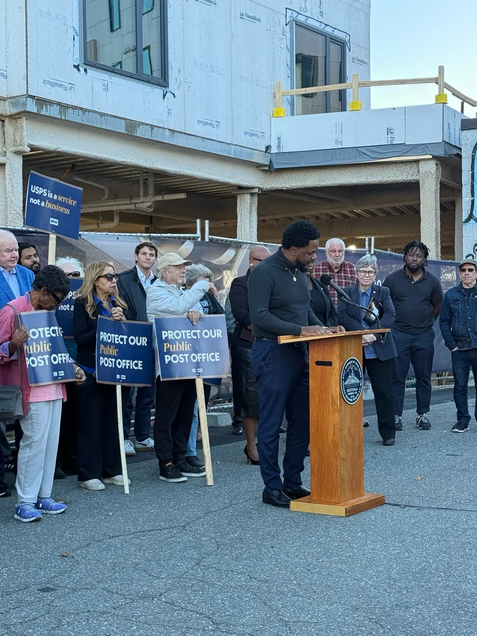 When the Allston post office on Harvard Avenue closed its doors in 2019, we were told it was temporary. Seven years later, over 80,000 residents across Allston and Brighton are still forced to rely on a single, overcrowded post office. This is flat-o