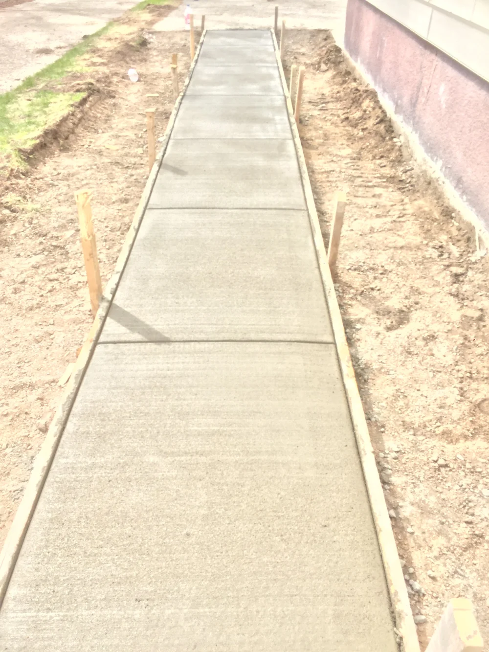 Freshly poured concrete garage pad