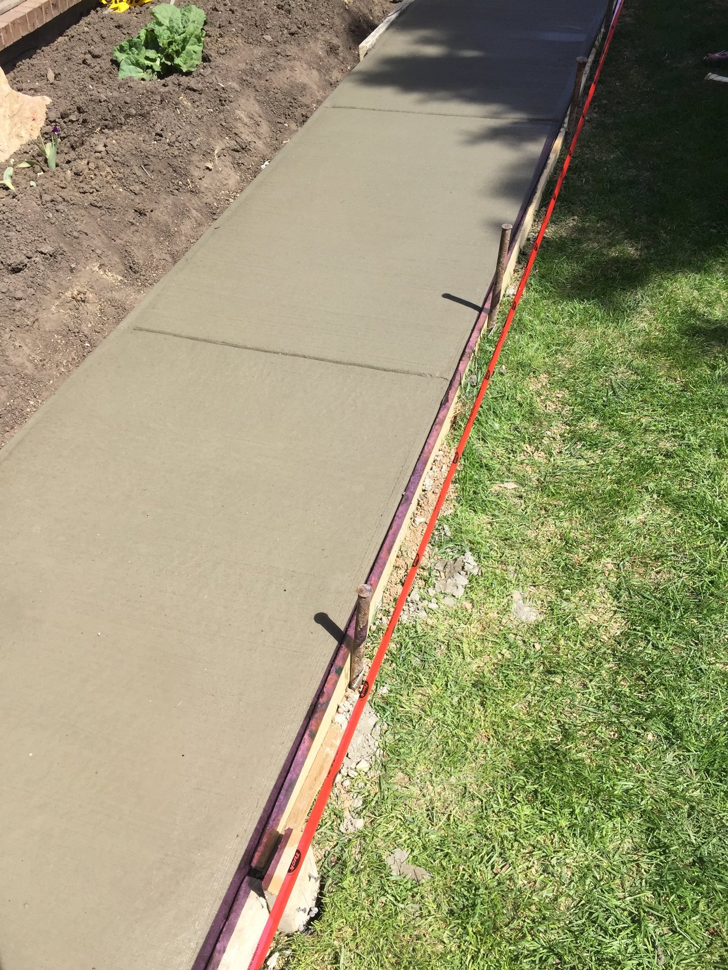 Broom-finished concrete driveway in Saskatoon