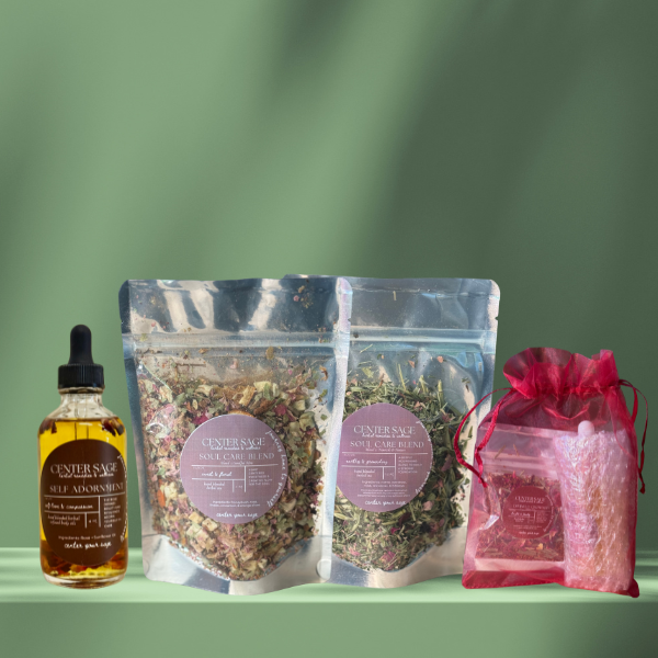 Three glass bowls filled with different types of creamy desserts topped with dried flower petals and herbs on a kitchen countertop.